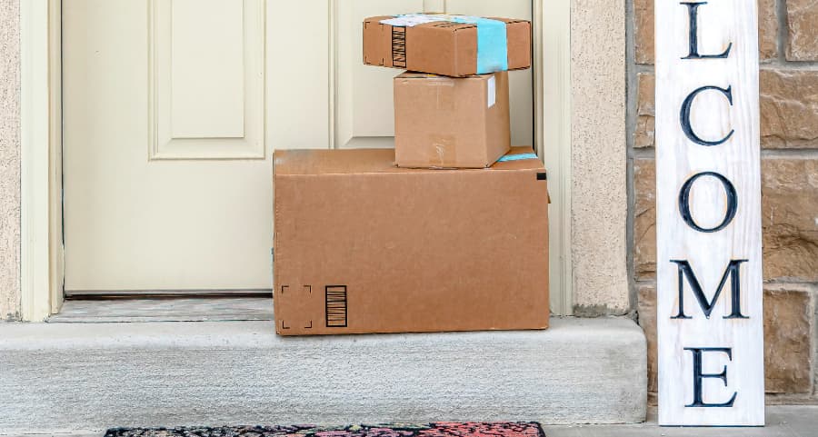 Boxes by the door of a residence with a welcome sign in Palm Springs